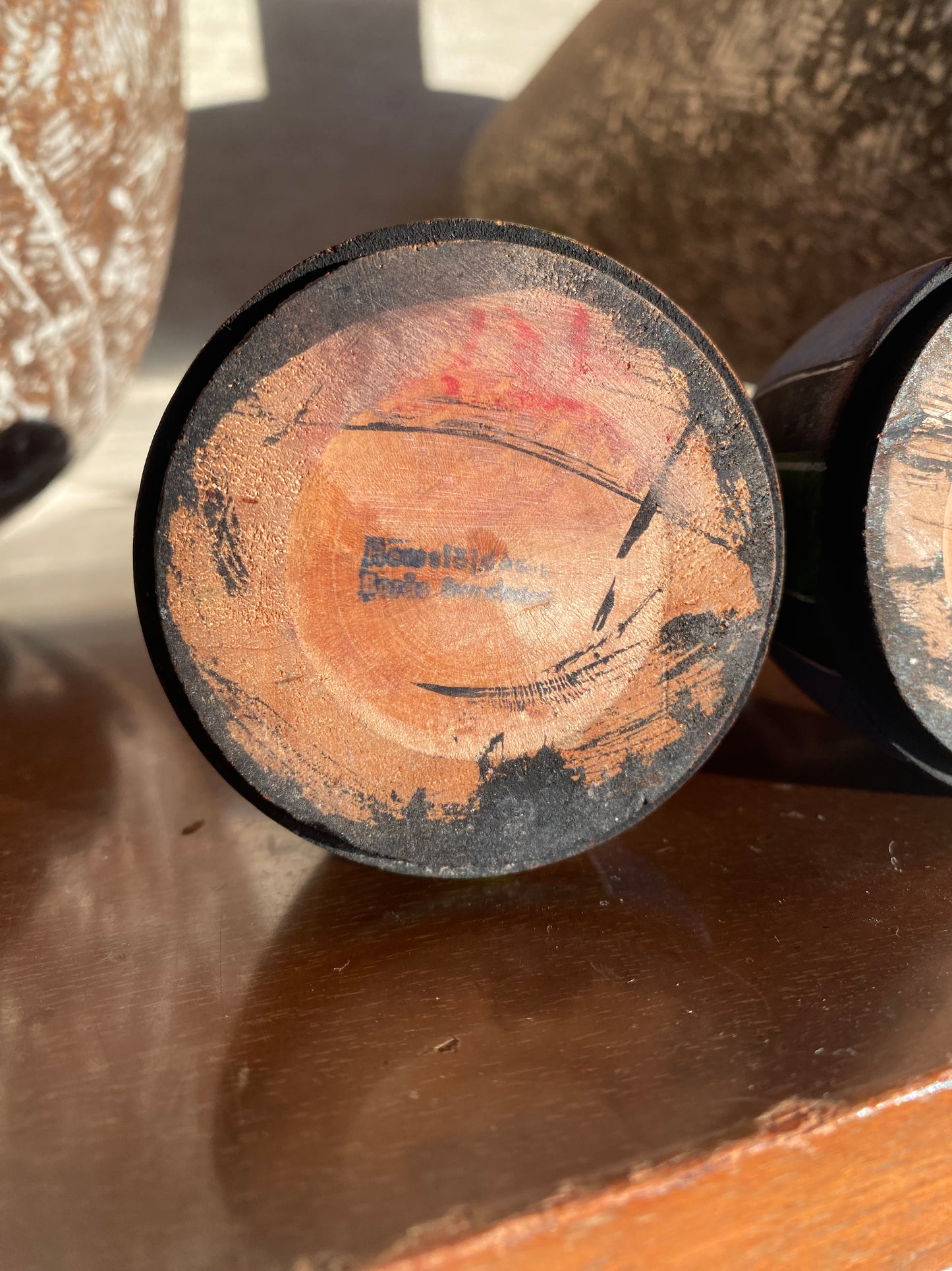 Close-up of a wooden object with visible grain and texture