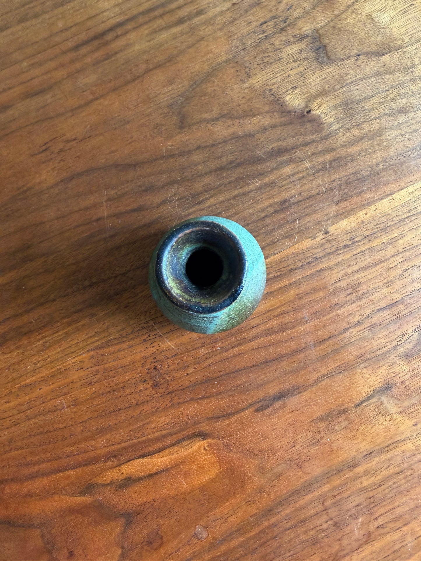 ceramic vase on a wooden surface