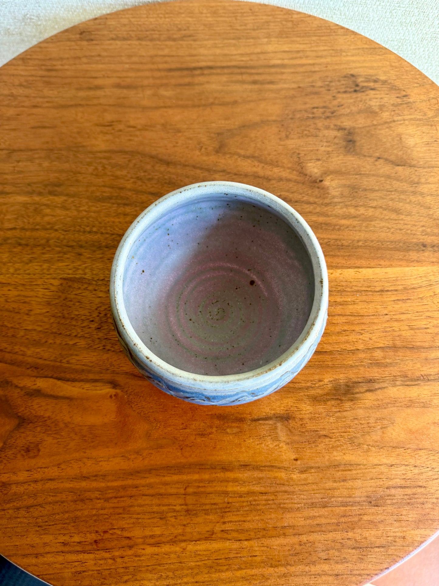 ceramic bowl on wood table
