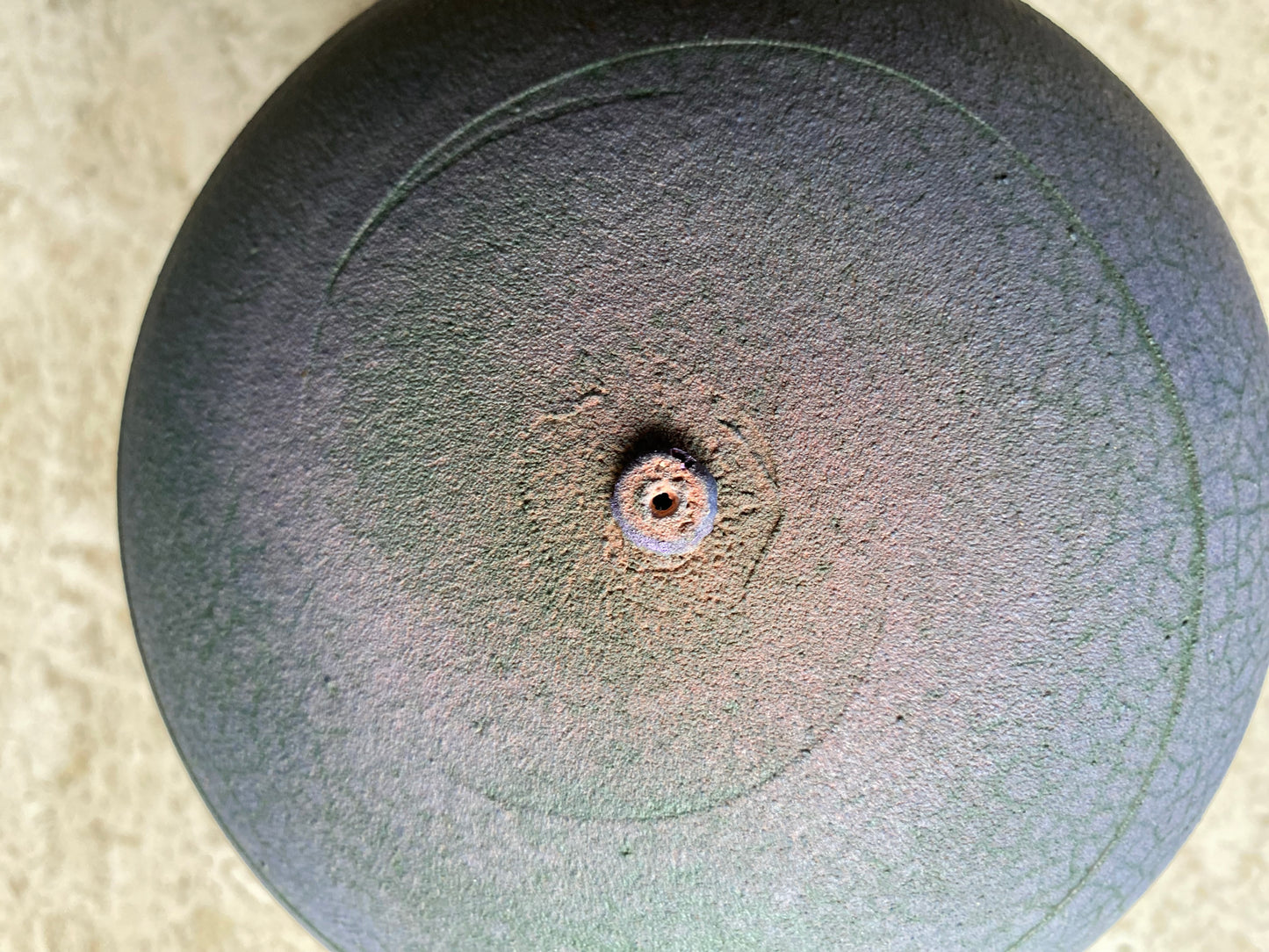 purple ceramic vase with swirl texture