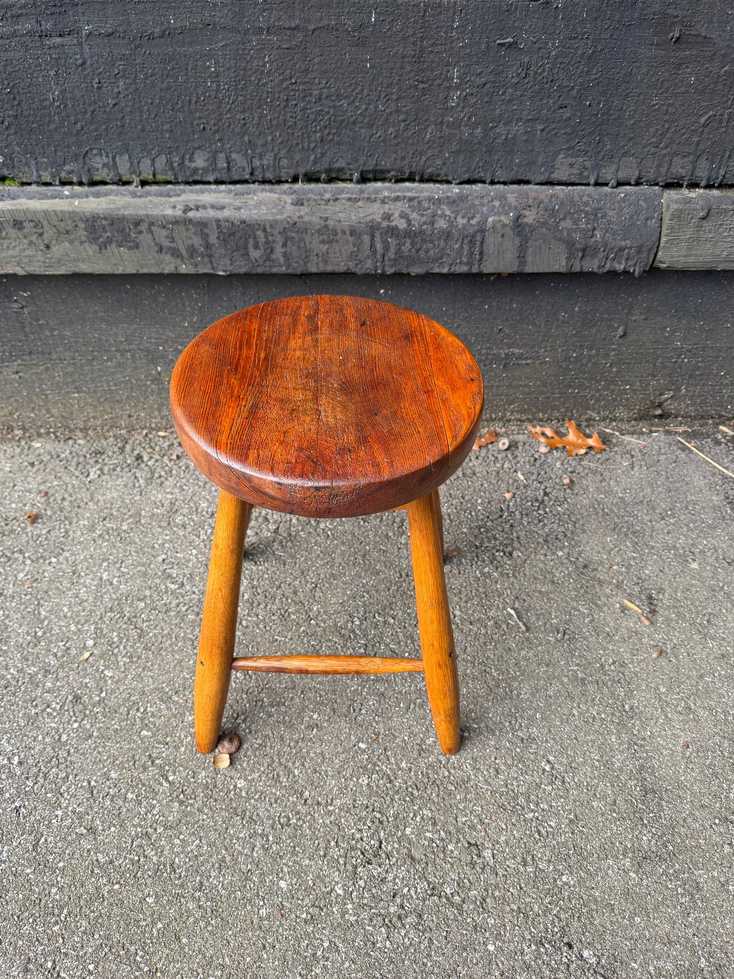 Wooden stool on a concrete surface
