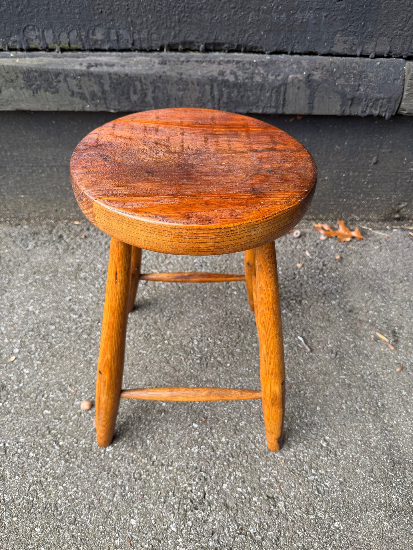 Wooden stool on a concrete surface