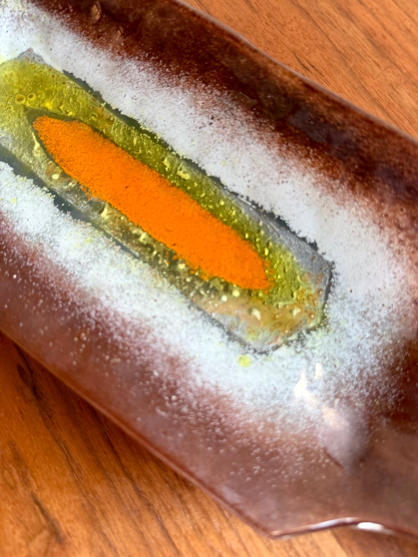 close up of glass tray on wooden table 