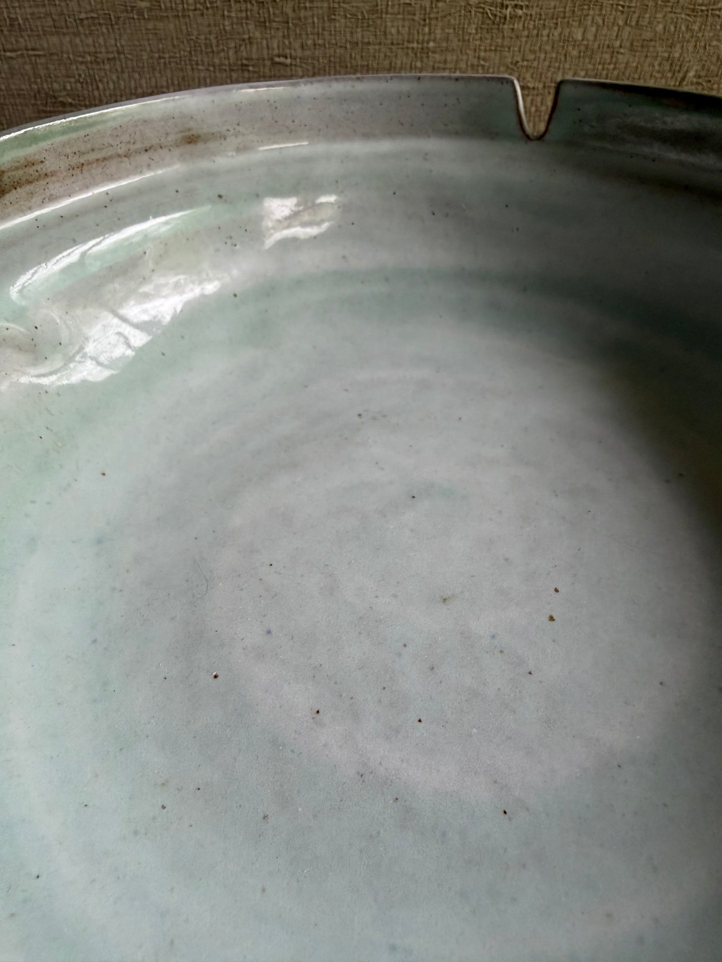 Close-up of a ceramic plate with a textured surface
