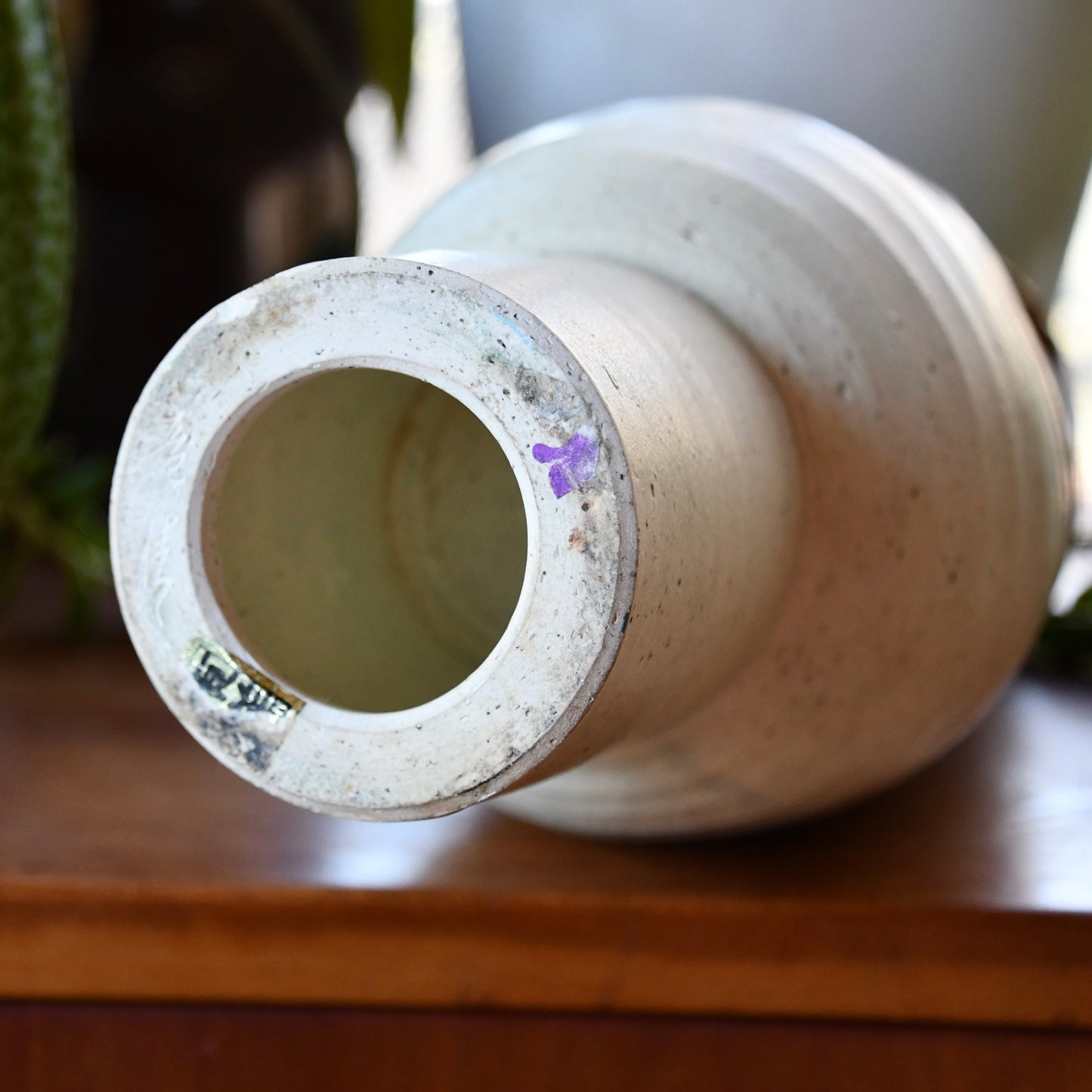 Close-up of a ceramic vase with a blurred background