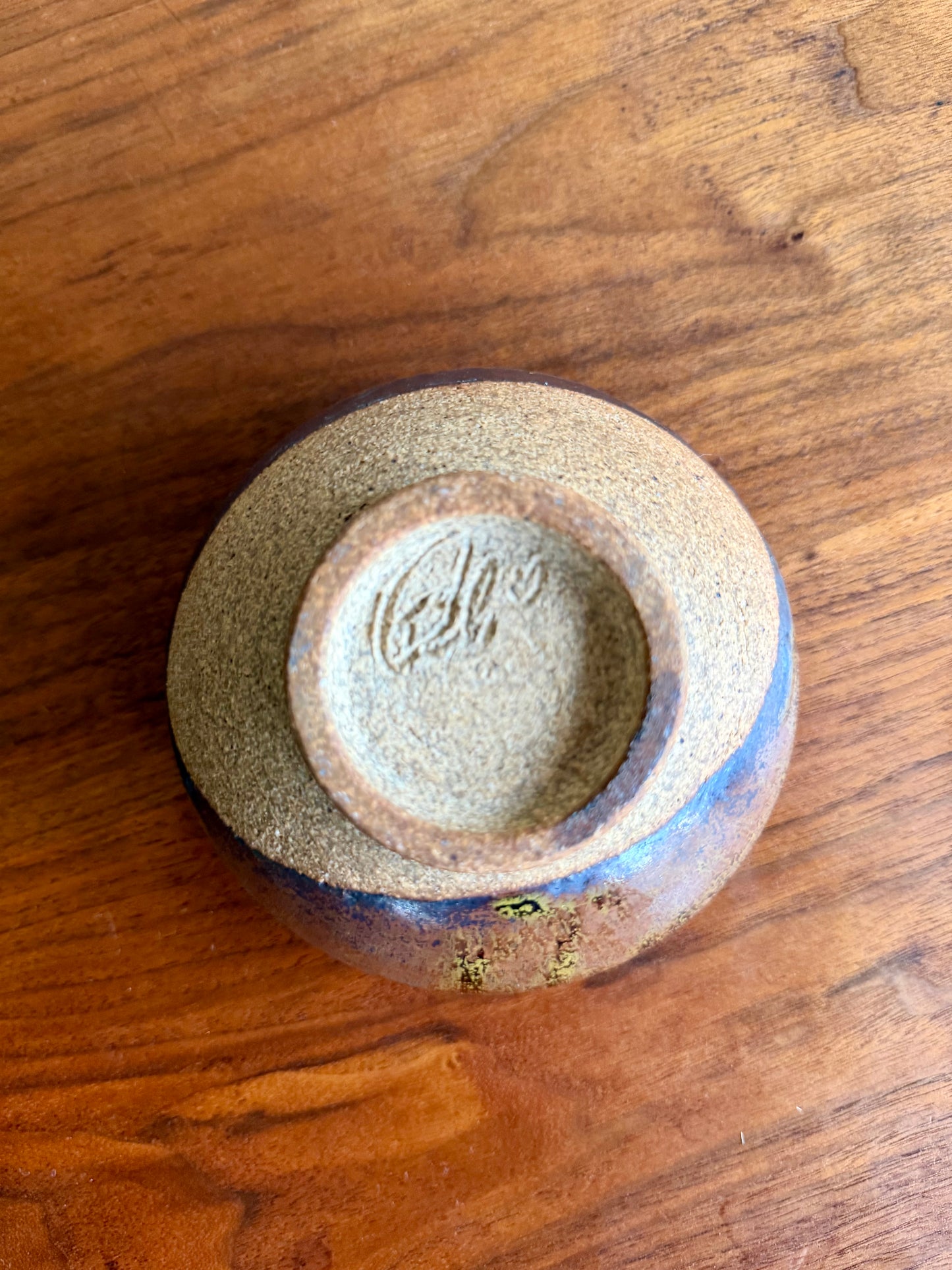 Ceramic bowl with a textured surface on a wooden table