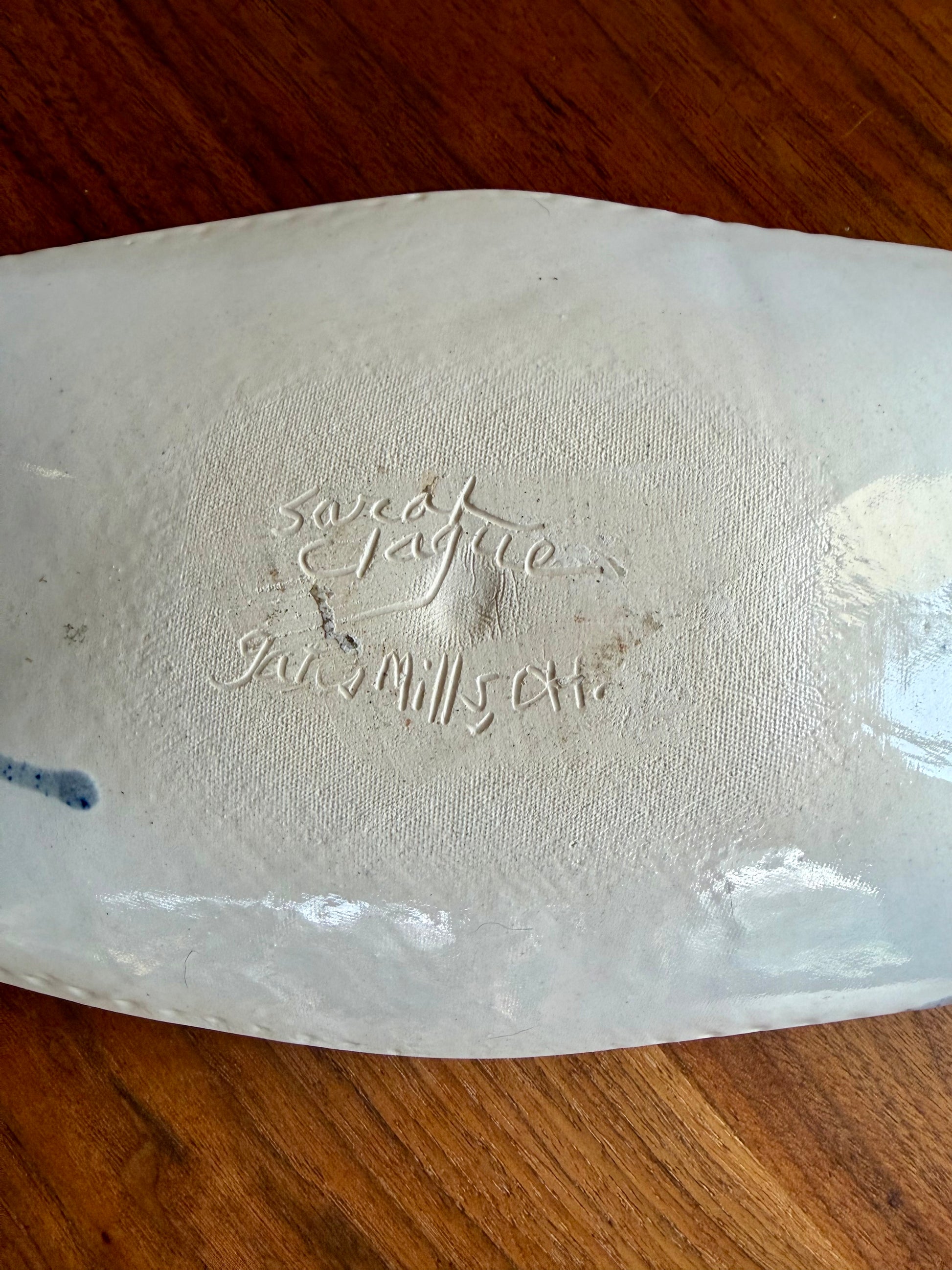 Bottom of pottery tray signed Sarah Clague Gates Mills, Ohio 