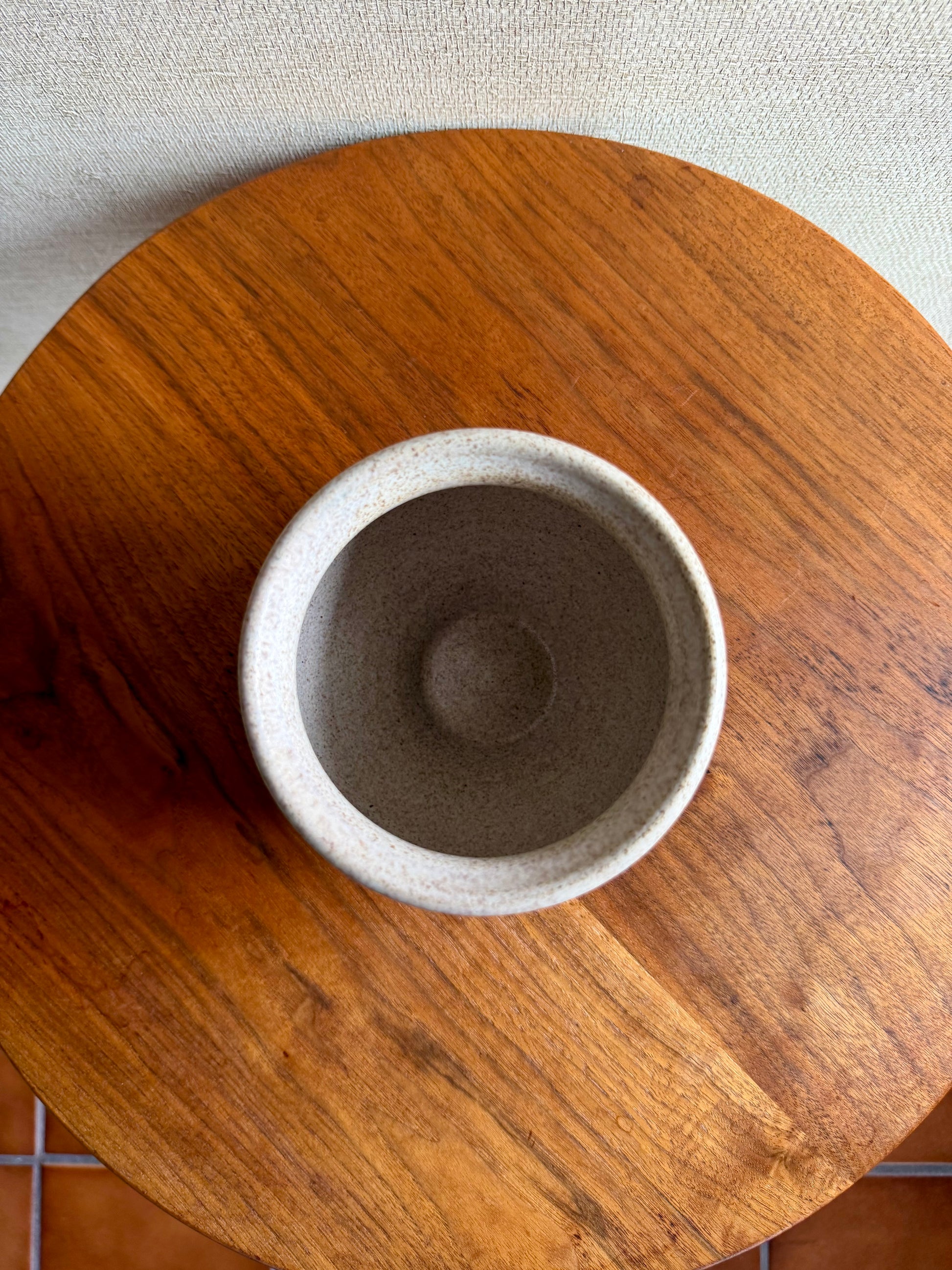 Ceramic bowl on a wooden surface