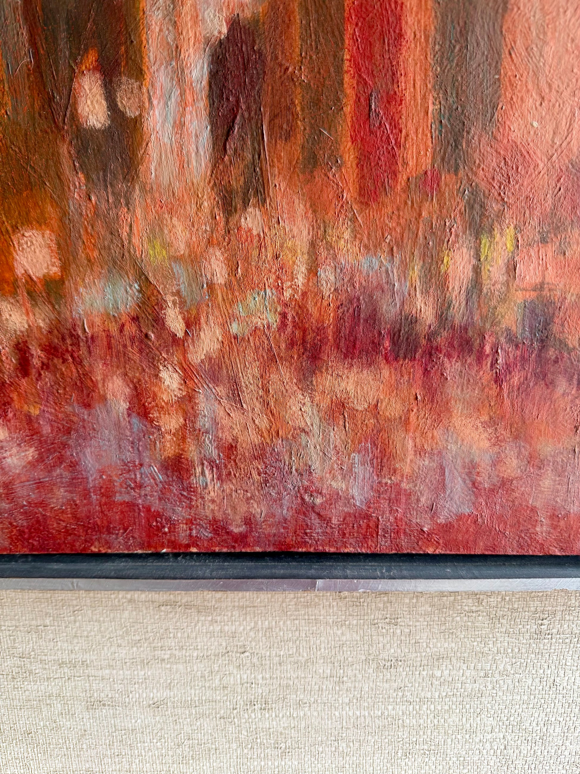 Abstract painting with warm tones on a textured surface