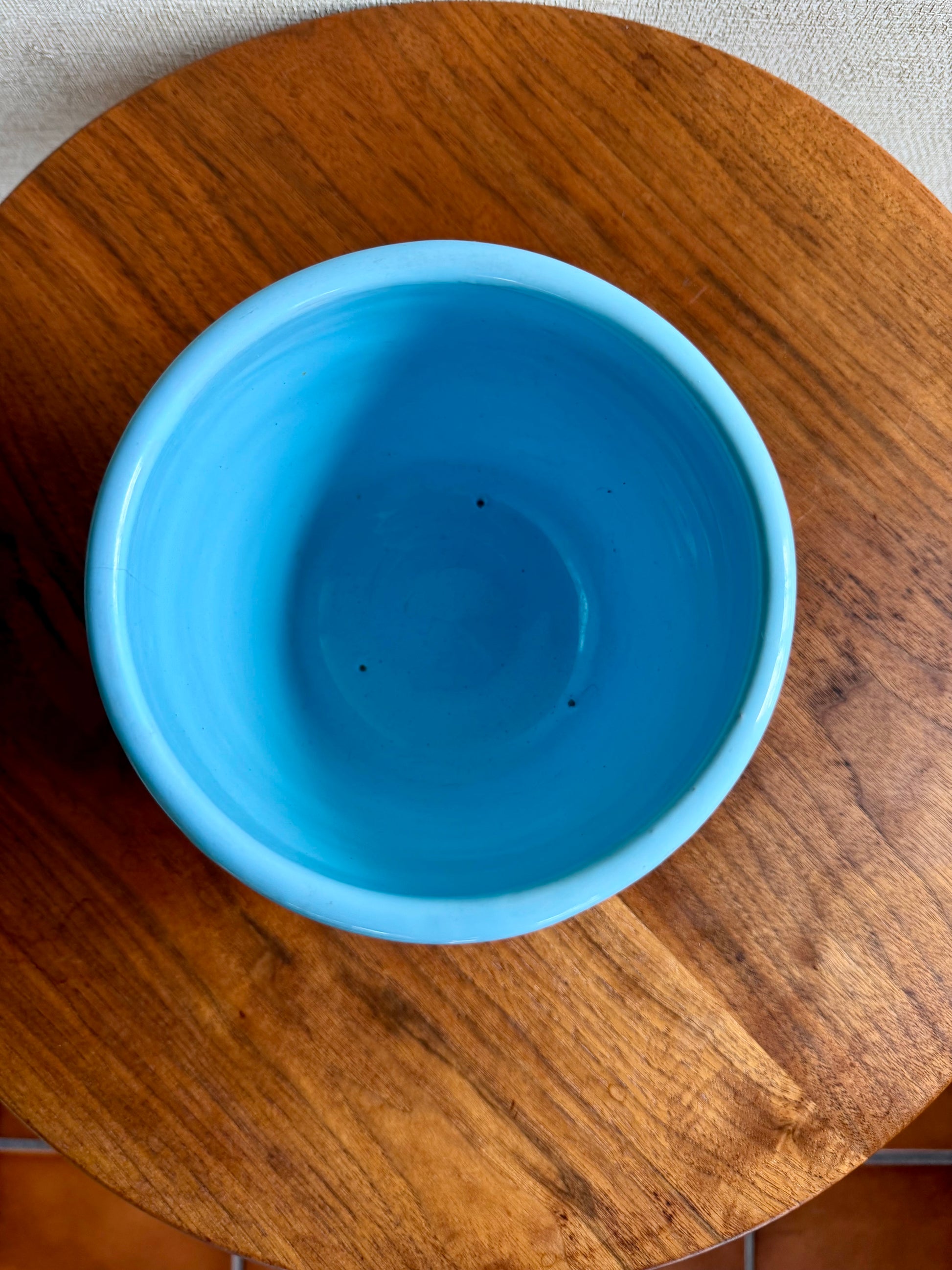 Blue bowl on a wooden surface