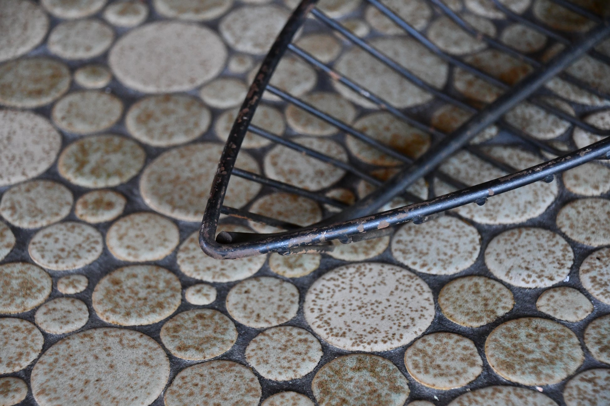 black metal basket on a textured stone surface