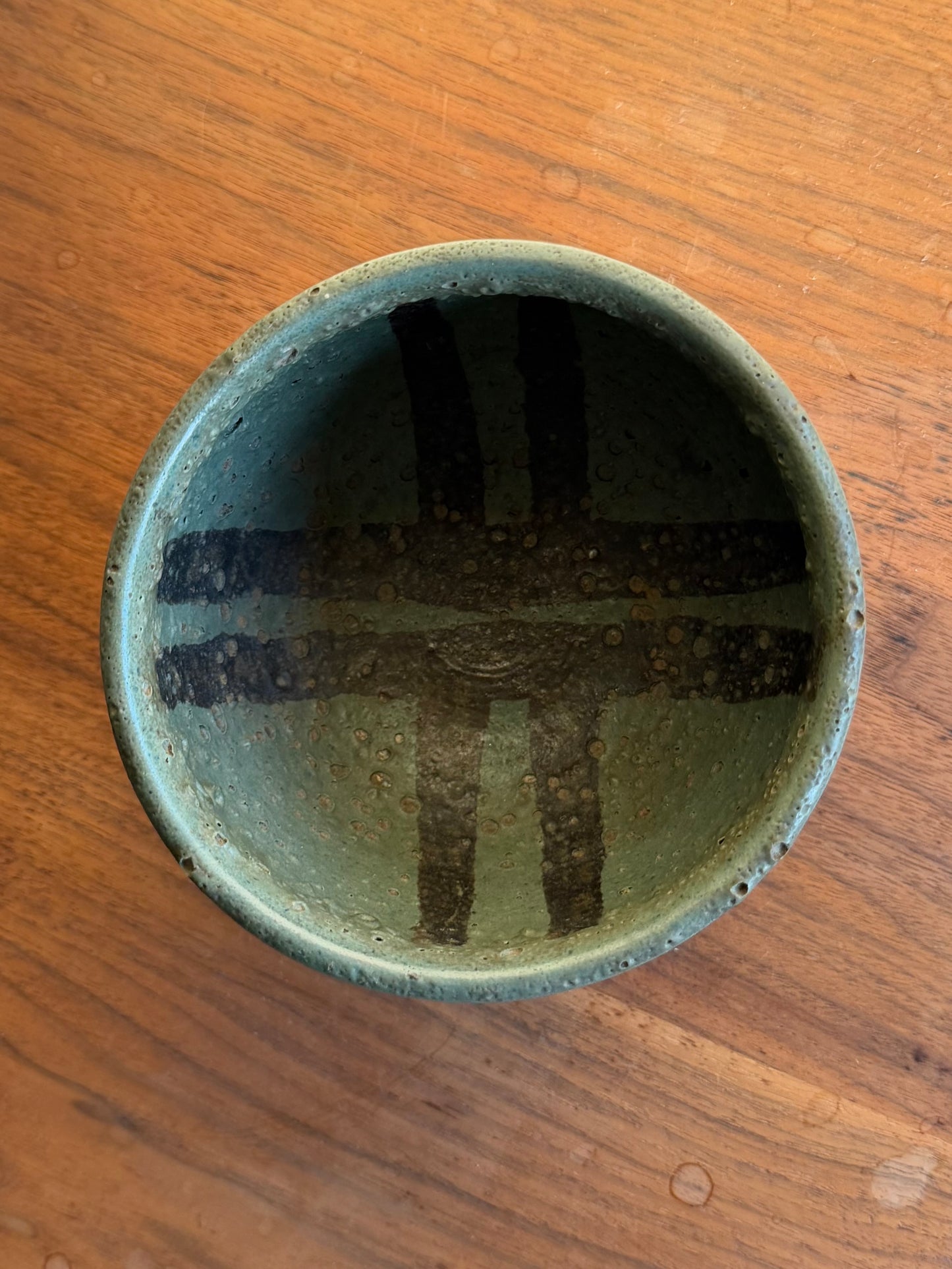 Ceramic bowl with textured surface on a wooden table