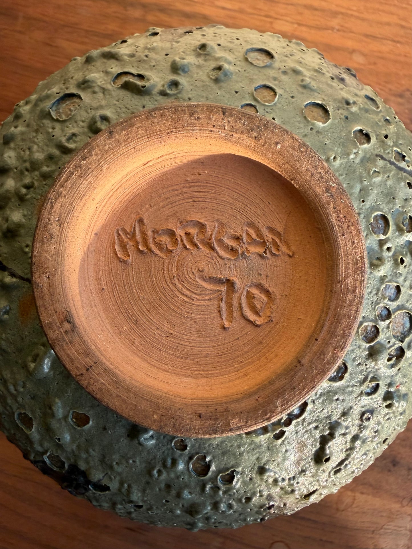 Ceramic bowl with textured exterior and 'Morley To' branding on the interior.
