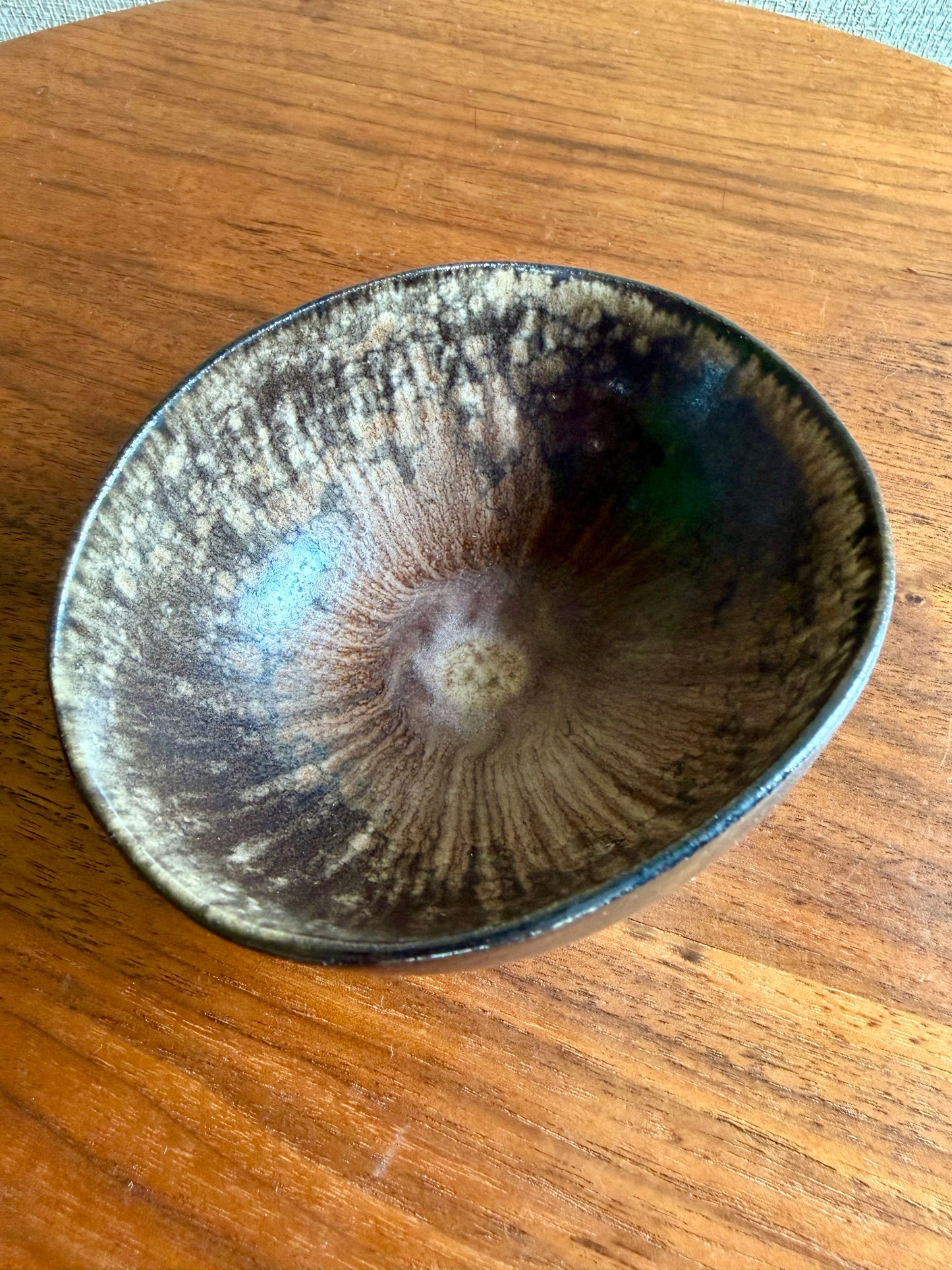 Ceramic bowl with textured surface on a wooden surface