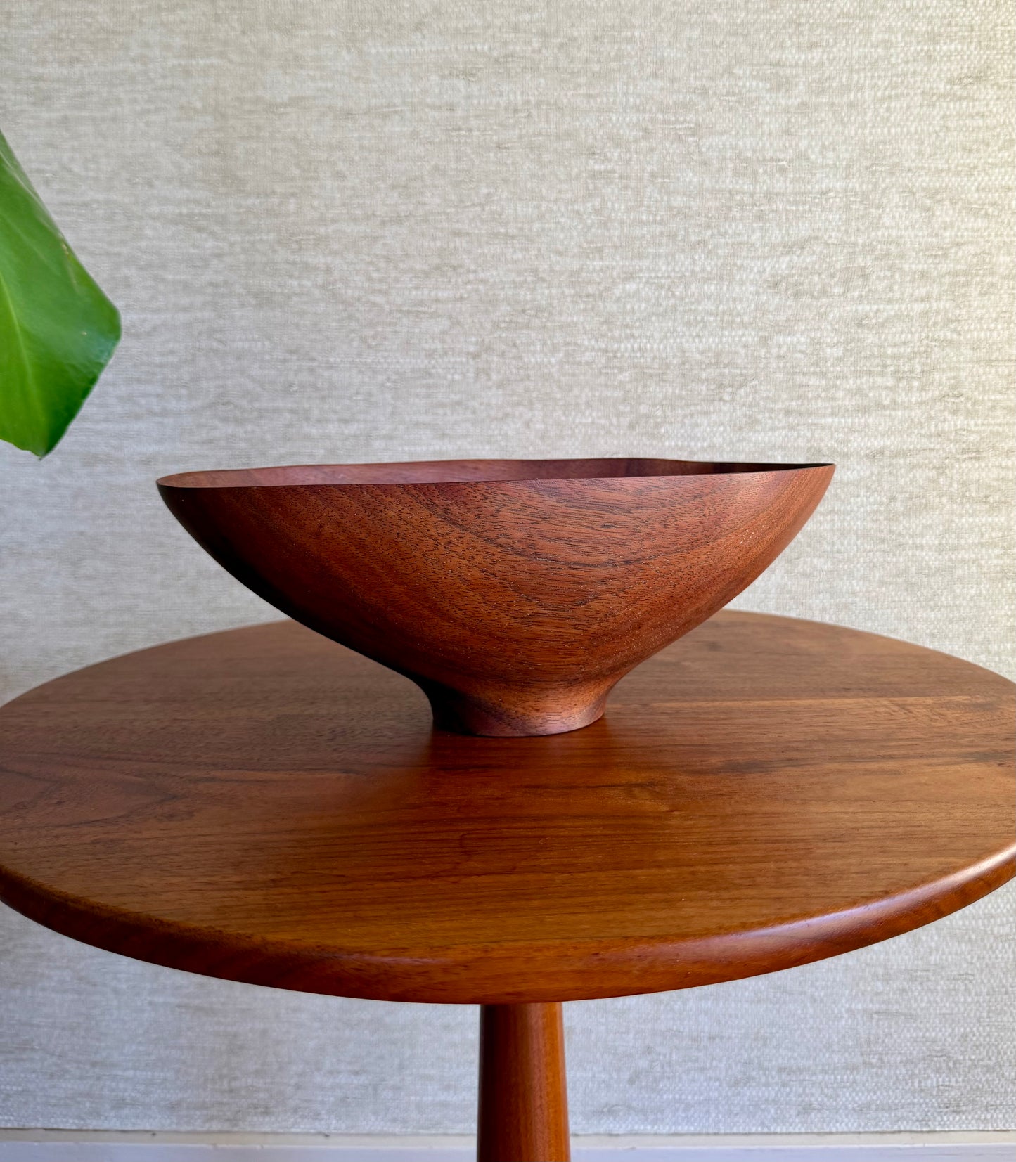 Wooden bowl on a wooden table with a neutral background