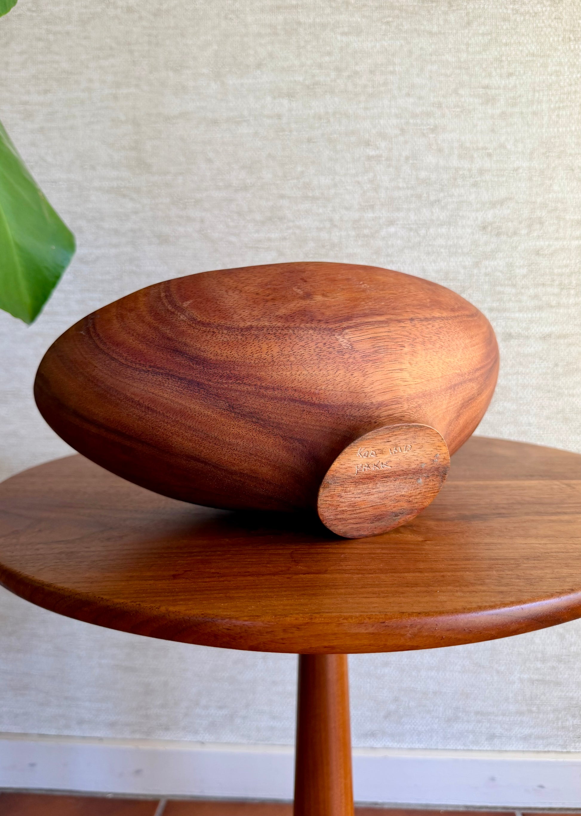 Wooden bowl on a wooden table with a neutral background