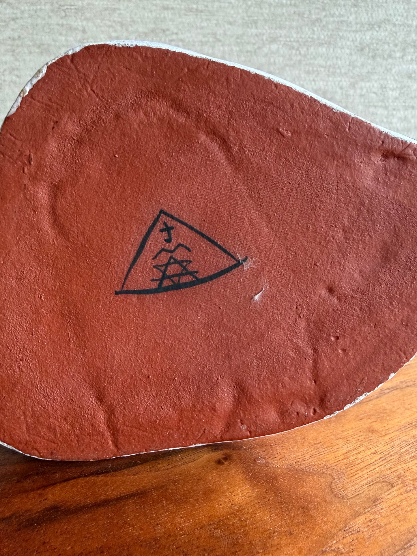 signature of artist on bottom of vase