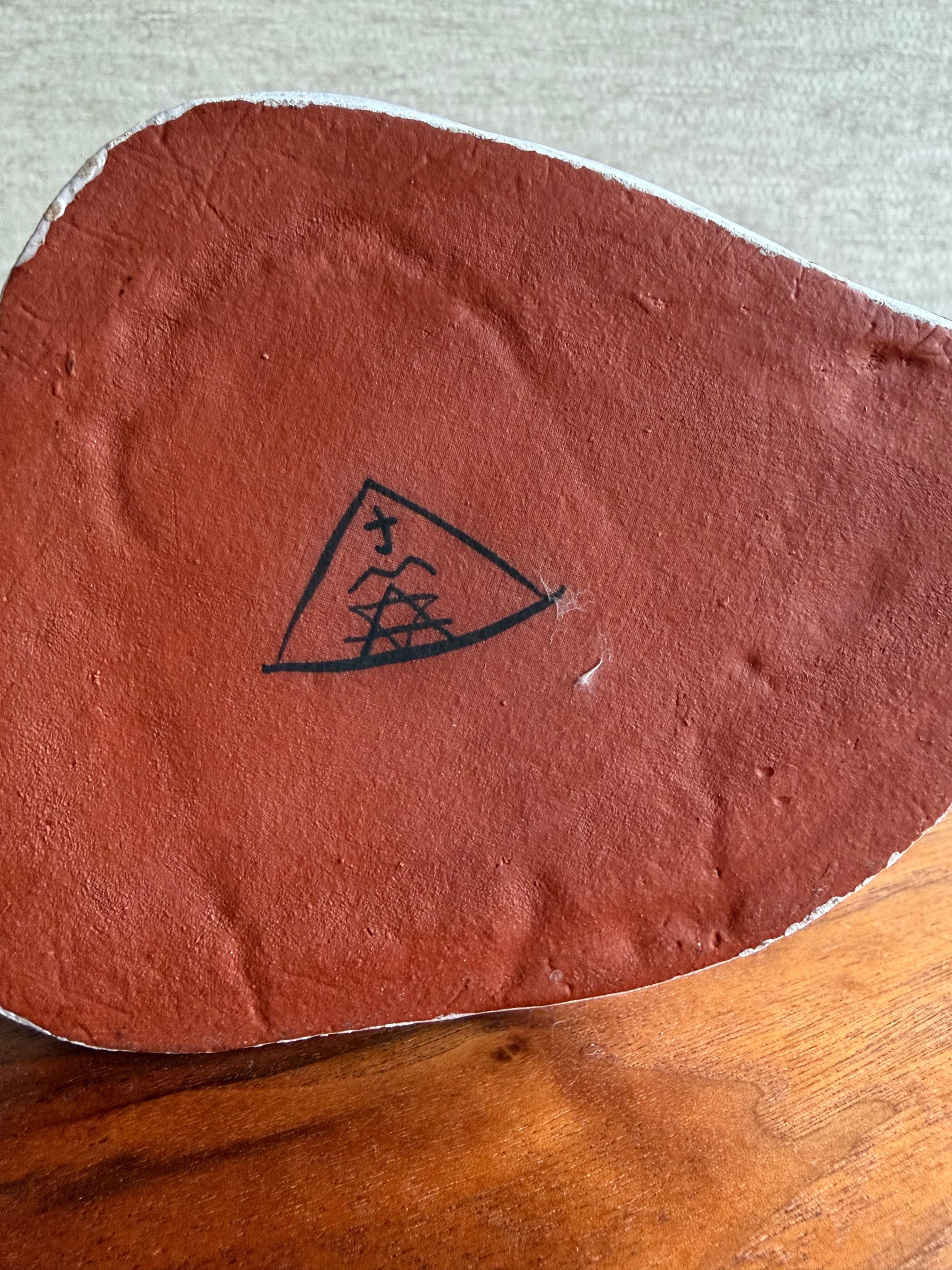 signature of artist on bottom of vase