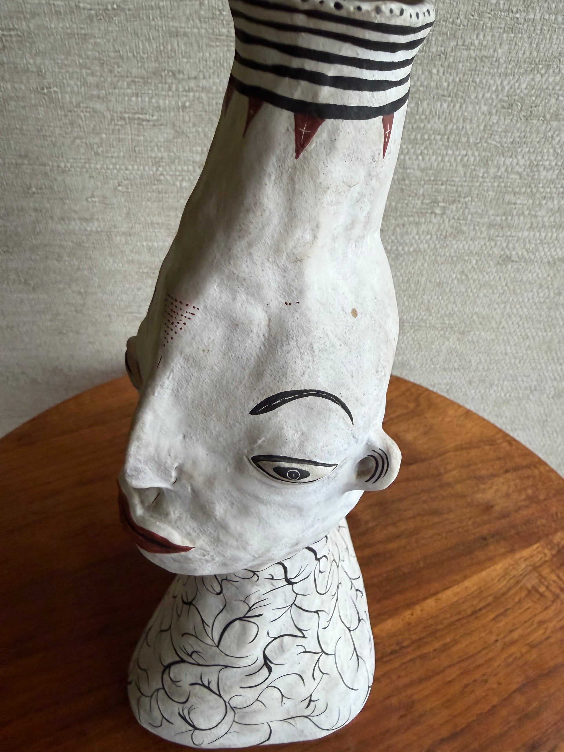 close-up of ceramic pottery face vase